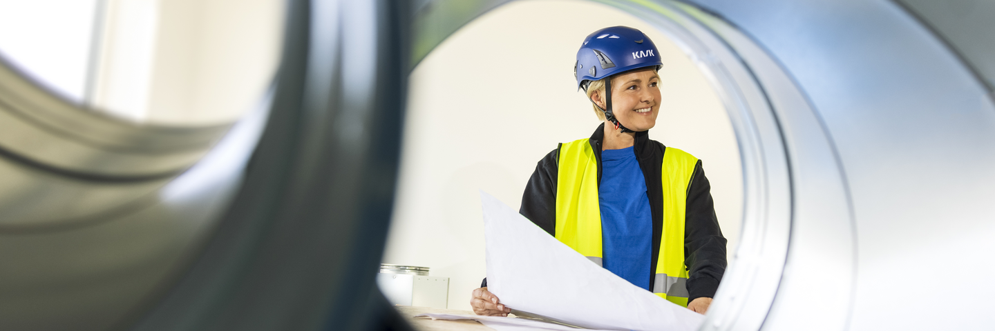 Construction site photo shoot session Experience Center EC High resolution Woman drawing duct Annica Pettersson
